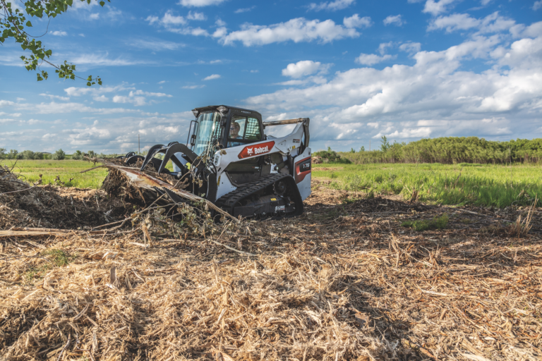 Bobcat moving debris available for rent at Ryno's Rental